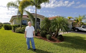 Robert Davidson stands in front of the home he purchased in 2011 in a golf course community in Naples, Florida
